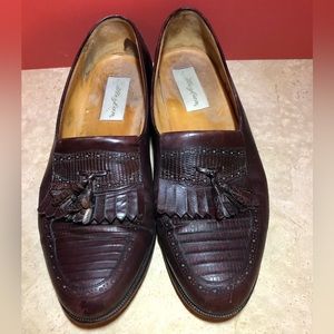 Brown/ cordovan loafers. Median with tassel and fringe.